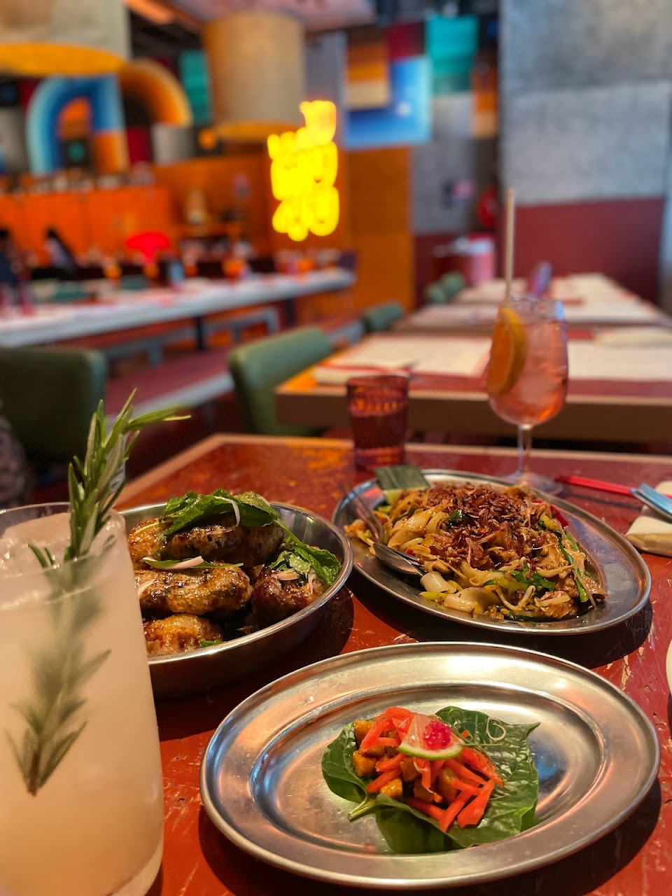MuMu table spread with cocktails and share plates